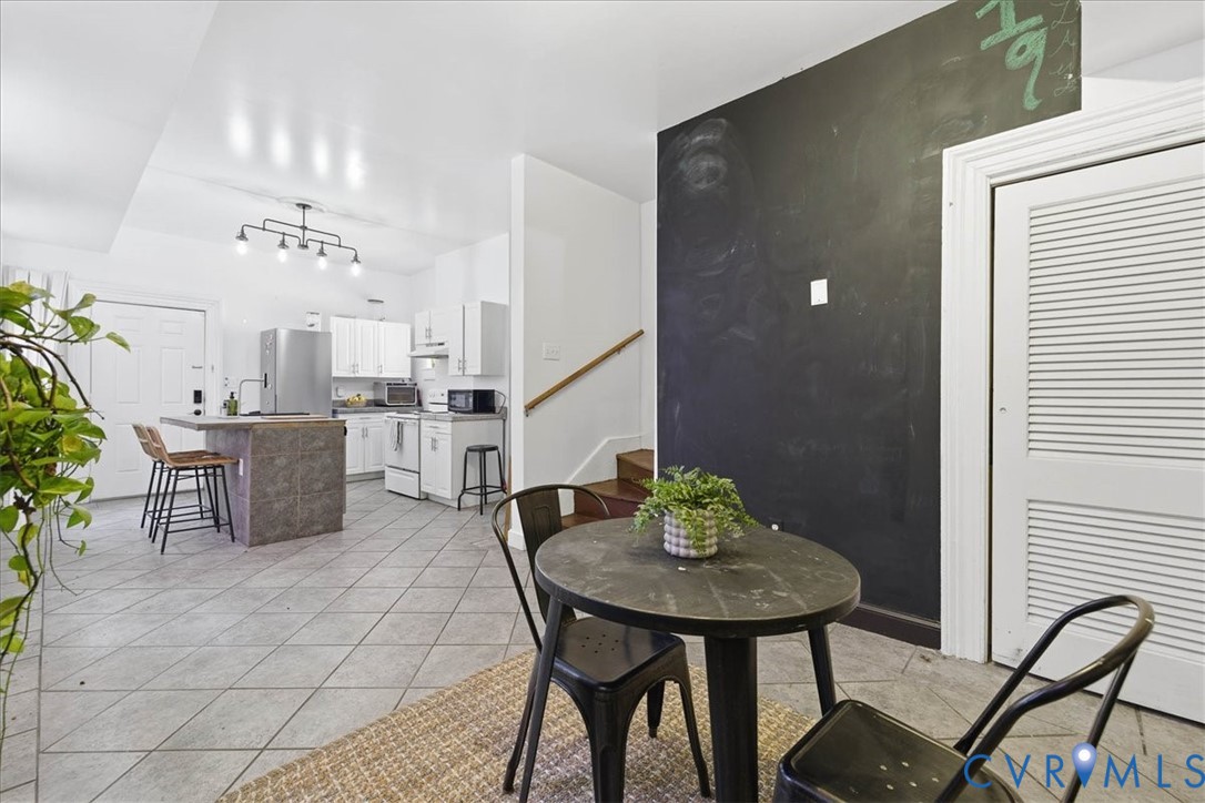 19 East Clay Street Richmond, VA 23219 - Photo 11 of 31 a view of a dining room with furniture and chandelier
