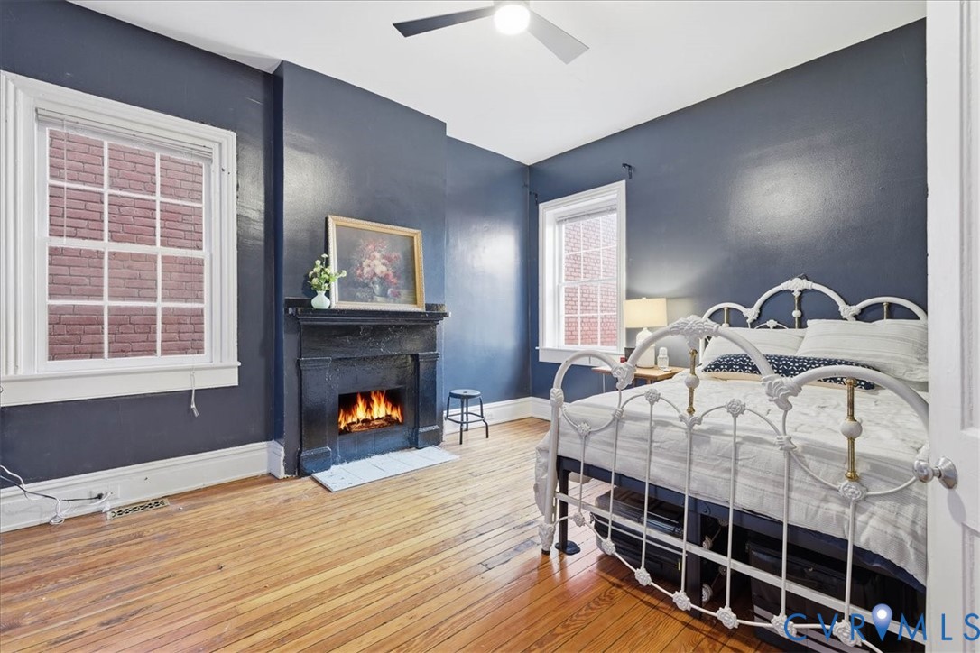 19 East Clay Street Richmond, VA 23219 - Photo 30 of 31 a bedroom with bed and a fireplace