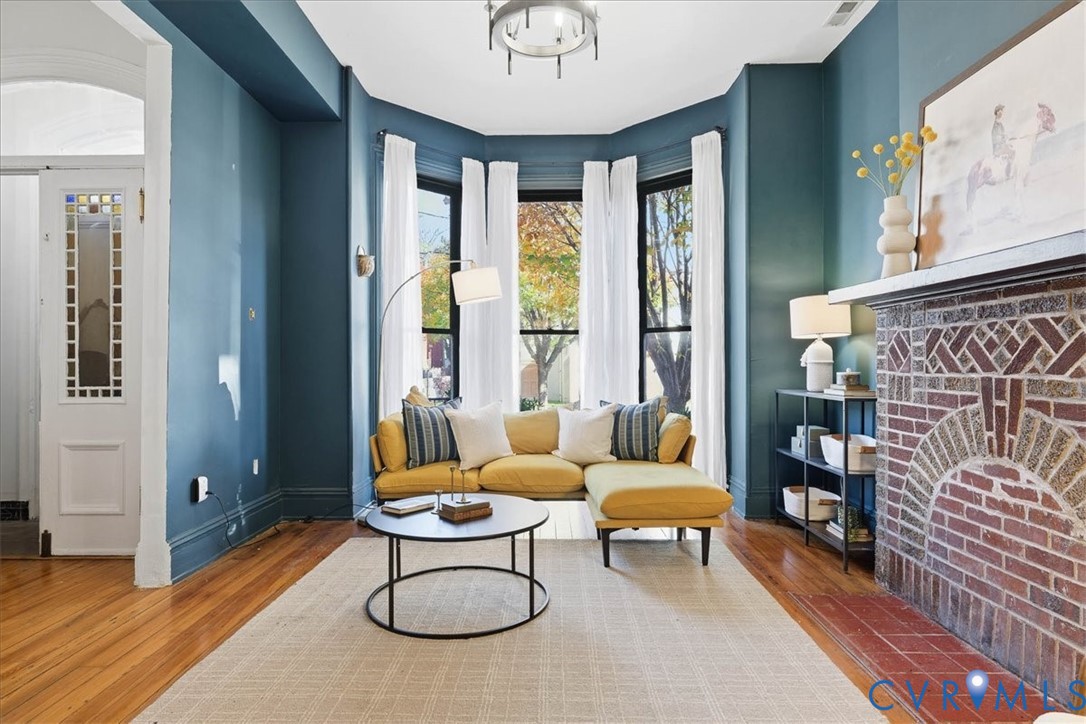 19 East Clay Street Richmond, VA 23219 - Photo 6 of 31 a living room with furniture and a large window