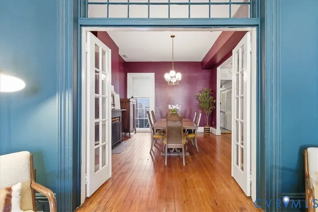 a view of a dining room with furniture and wooden floor