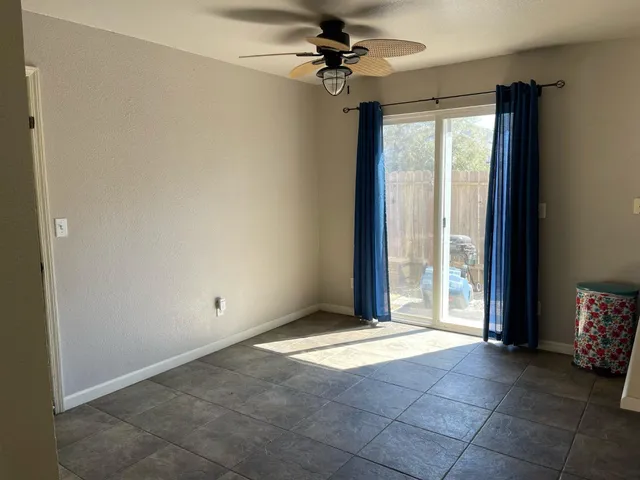 a view of an empty room with a window