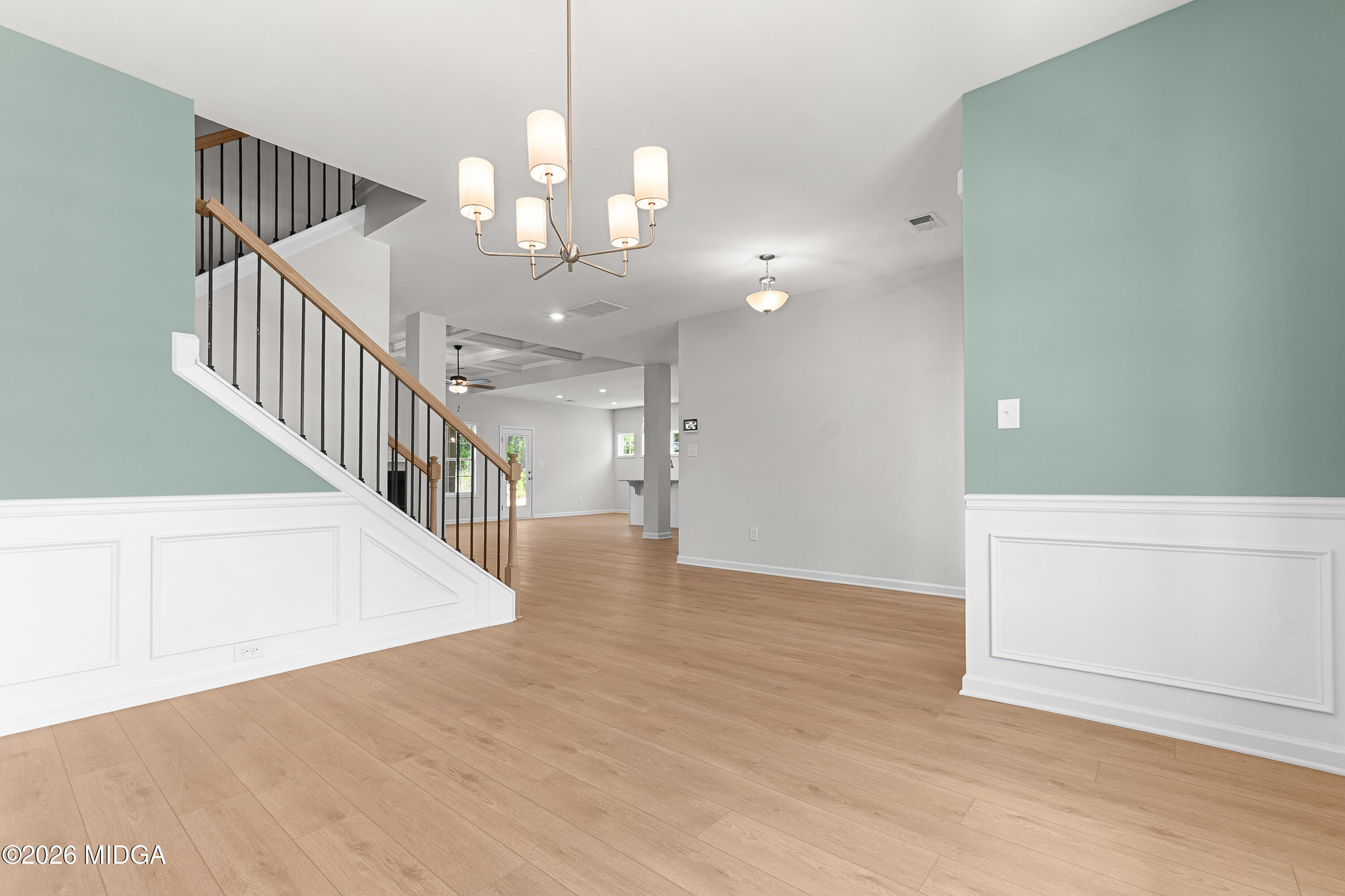 5393 Felles Way, Unit 359 Forsyth, GA 31029 - Photo 6 of 54 a view of a hallway with wooden floor and staircase