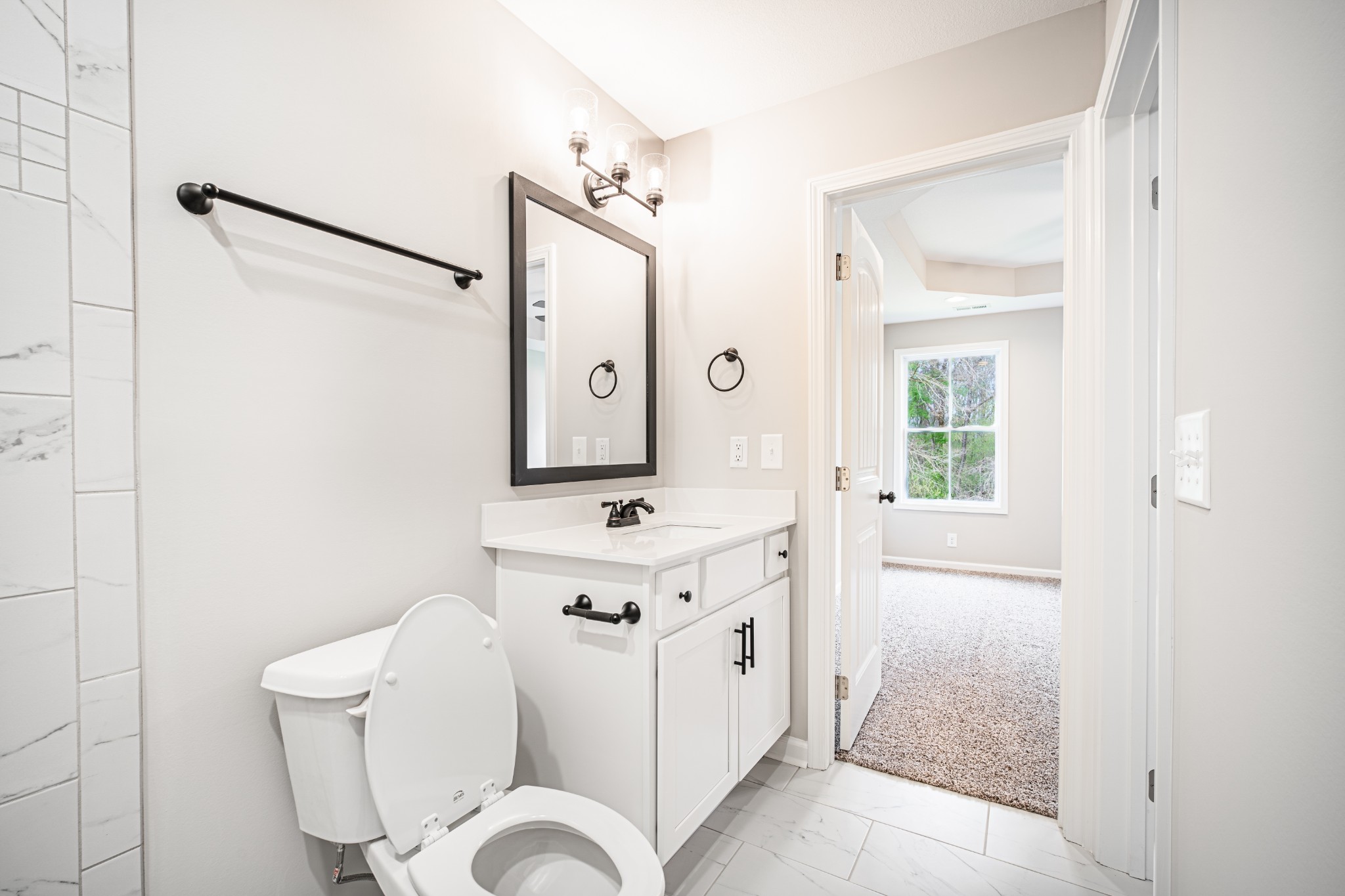 46 Bunker Hill Road Clarksville, TN 37042 - Photo 13 of 14 a spacious bathroom with a toilet sink and mirror