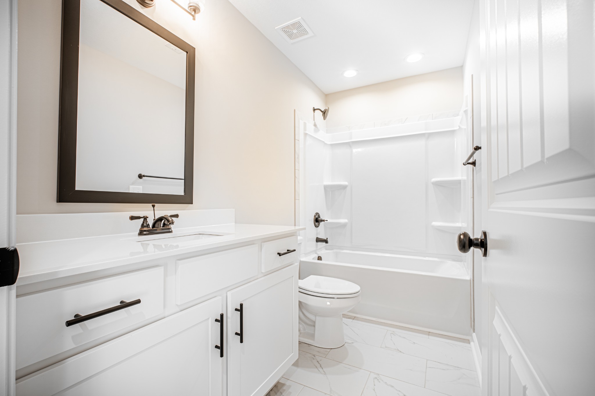 46 Bunker Hill Road Clarksville, TN 37042 - Photo 9 of 14 a bathroom with a bathtub shower sink vanity mirror and toilet