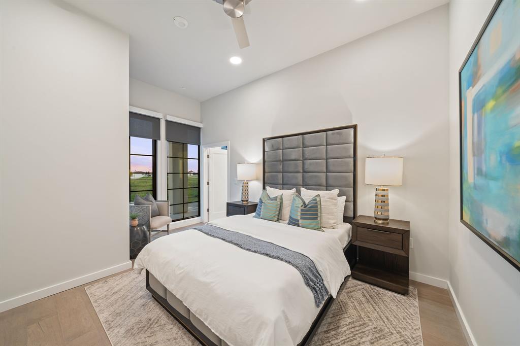 3111 Sunset Boulevard, Unit A01 Flower Mound, TX 75022 - Photo 14 of 39 a bedroom with a bed and a large window