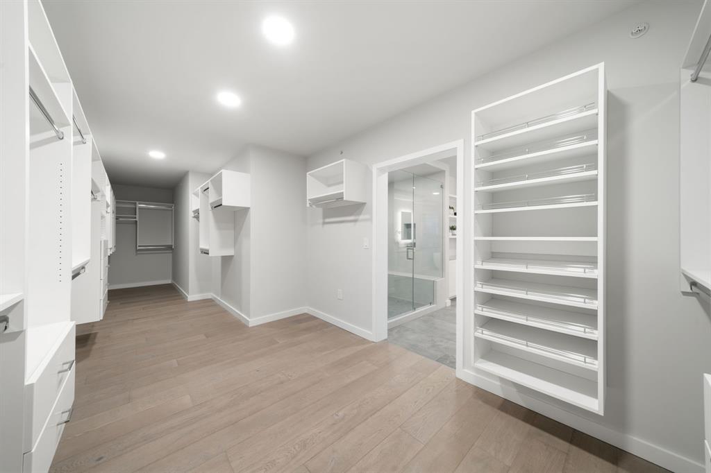 3111 Sunset Boulevard, Unit A01 Flower Mound, TX 75022 - Photo 16 of 39 a view of empty room with kitchen and refrigerator