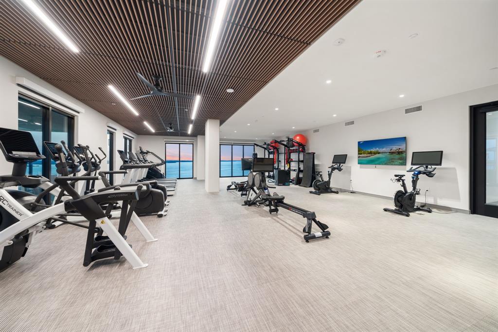 3111 Sunset Boulevard, Unit A01 Flower Mound, TX 75022 - Photo 21 of 39 a view of a room with gym equipment