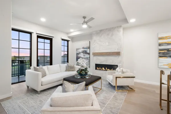 a dining room with furniture kitchen view and a chandelier