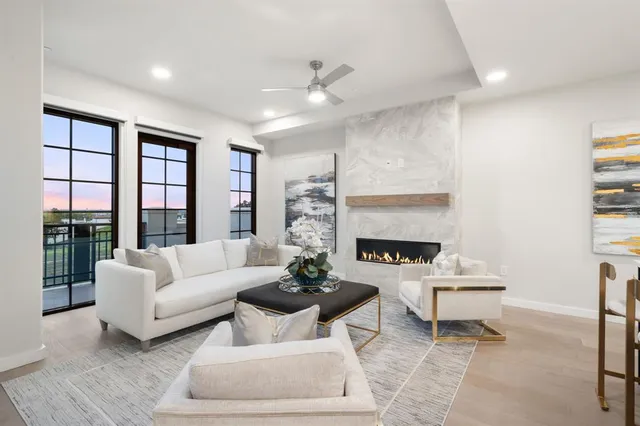 a dining room with furniture kitchen view and a chandelier