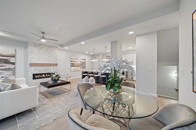 a living room with furniture and a lamp