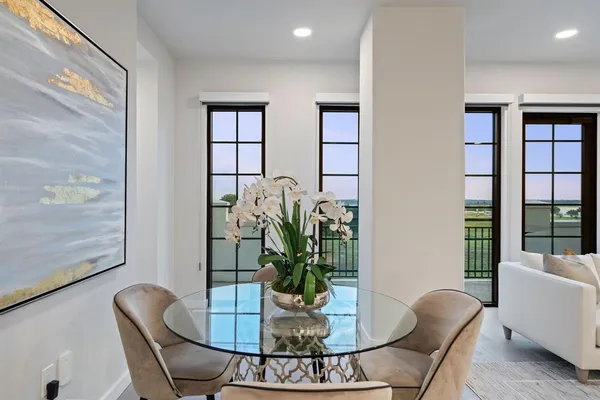 a spacious bathroom with a double vanity sink a large mirror and a shower