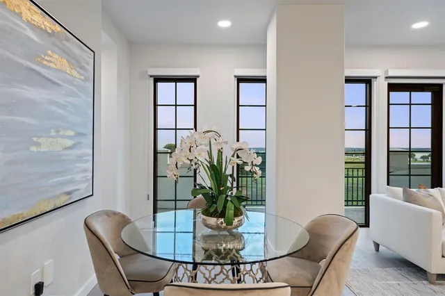 a spacious bathroom with a double vanity sink a large mirror and a shower