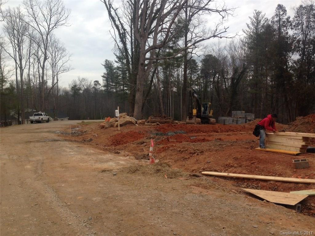 39 Ball Gap Road, Unit 2 Arden, NC 28704 - Photo 3 of 11 a backyard of a house with table and chairs