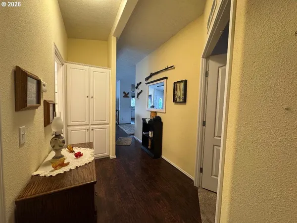 a bedroom with furniture and a wooden floor