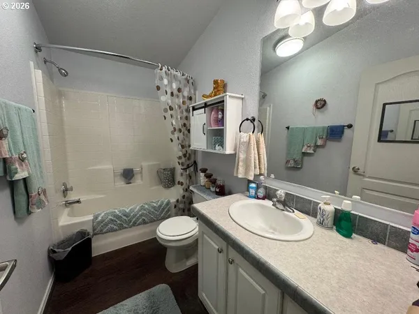 a room with a sink and a stove top oven