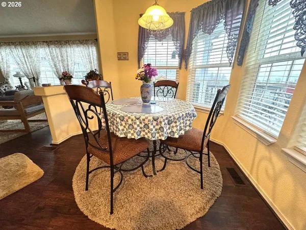 a kitchen with a stove a refrigerator and a sink