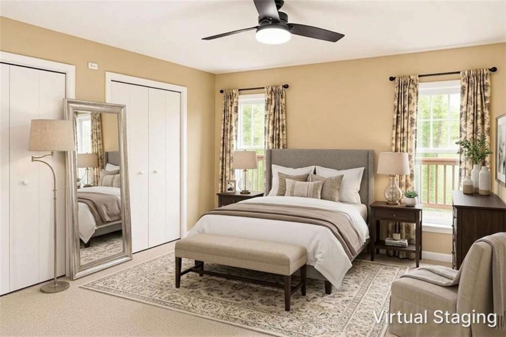 365 River Ridge Trail Oxford, GA 30054 - Photo 16 of 37 a bedroom with a bed and a chandelier