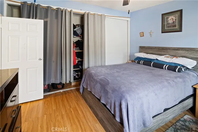 a bedroom with a bed and a walk in closet