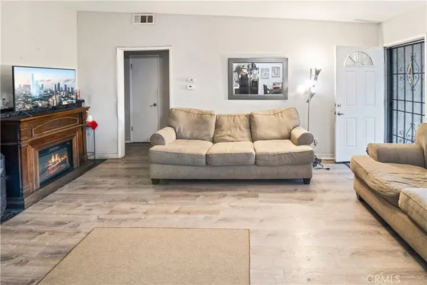 a living room with furniture and a fireplace