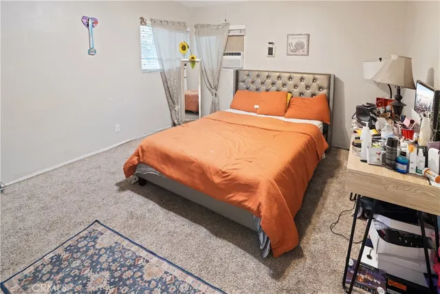 a bed room with a bed and a chair