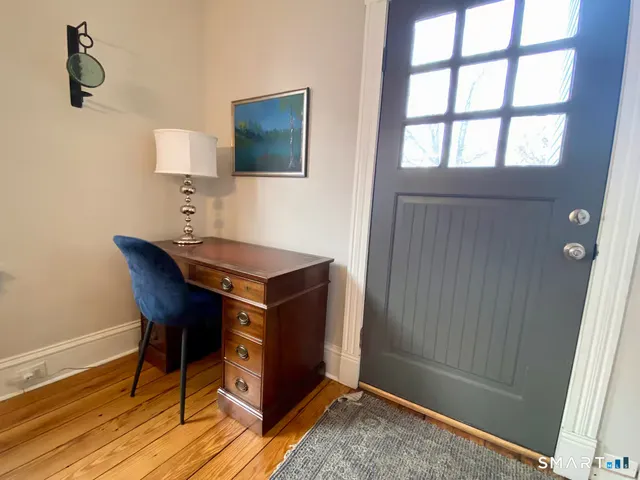 a room with a table and a mirror