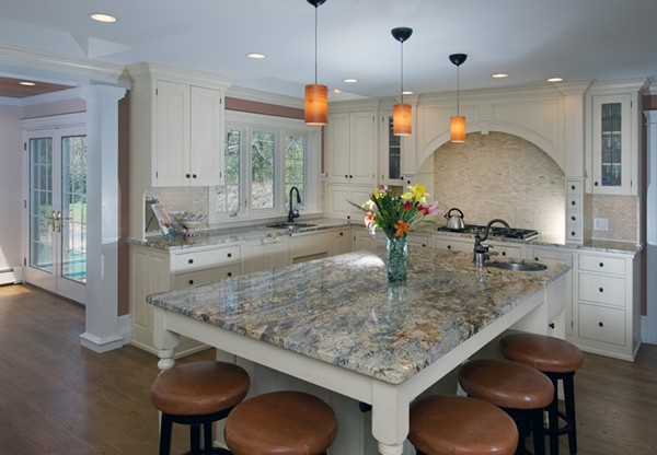 81 Carisbrooke Road Wellesley, MA 02481 - Photo 7 of 20 a kitchen with kitchen island granite countertop a table and chairs in it