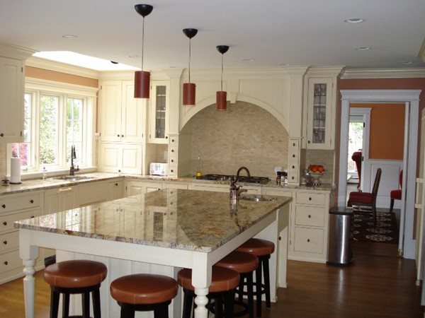 81 Carisbrooke Road Wellesley, MA 02481 - Photo 10 of 20 a kitchen with a table chairs stove and wooden floor