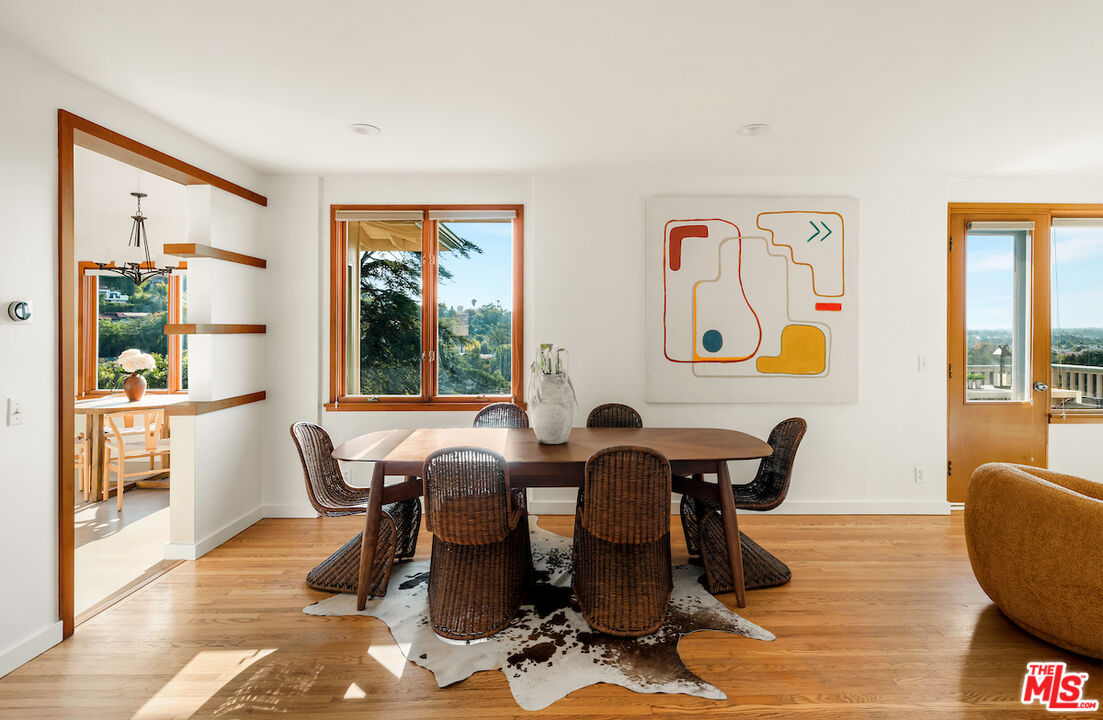 13201 Cheltenham Drive Sherman Oaks, CA 91423 - Photo 12 of 75 a view of a dining room with furniture window and wooden floor