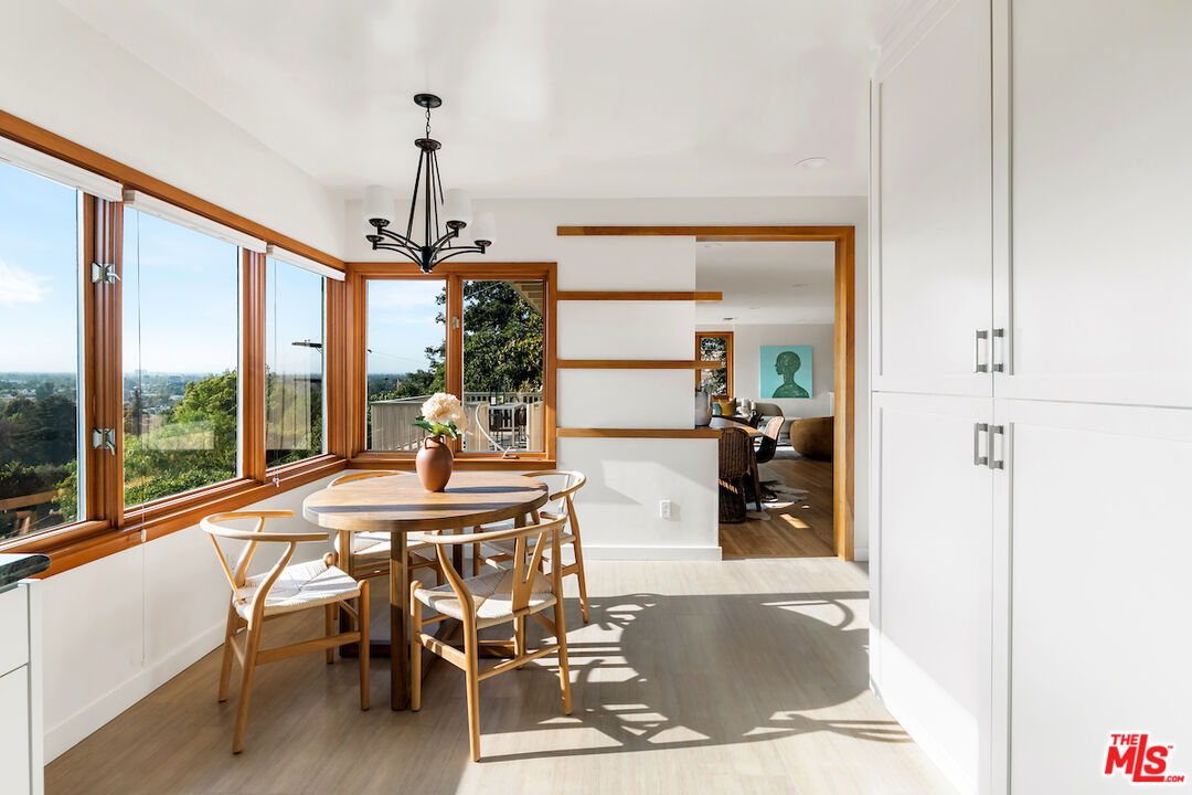 13201 Cheltenham Drive Sherman Oaks, CA 91423 - Photo 13 of 75 a view of a dining room with furniture window and outside view