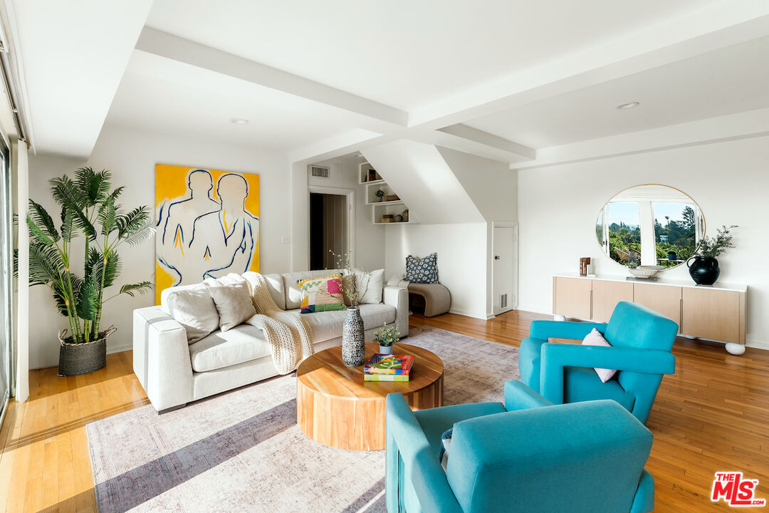 13201 Cheltenham Drive Sherman Oaks, CA 91423 - Photo 22 of 75 a living room with furniture fireplace and potted plant