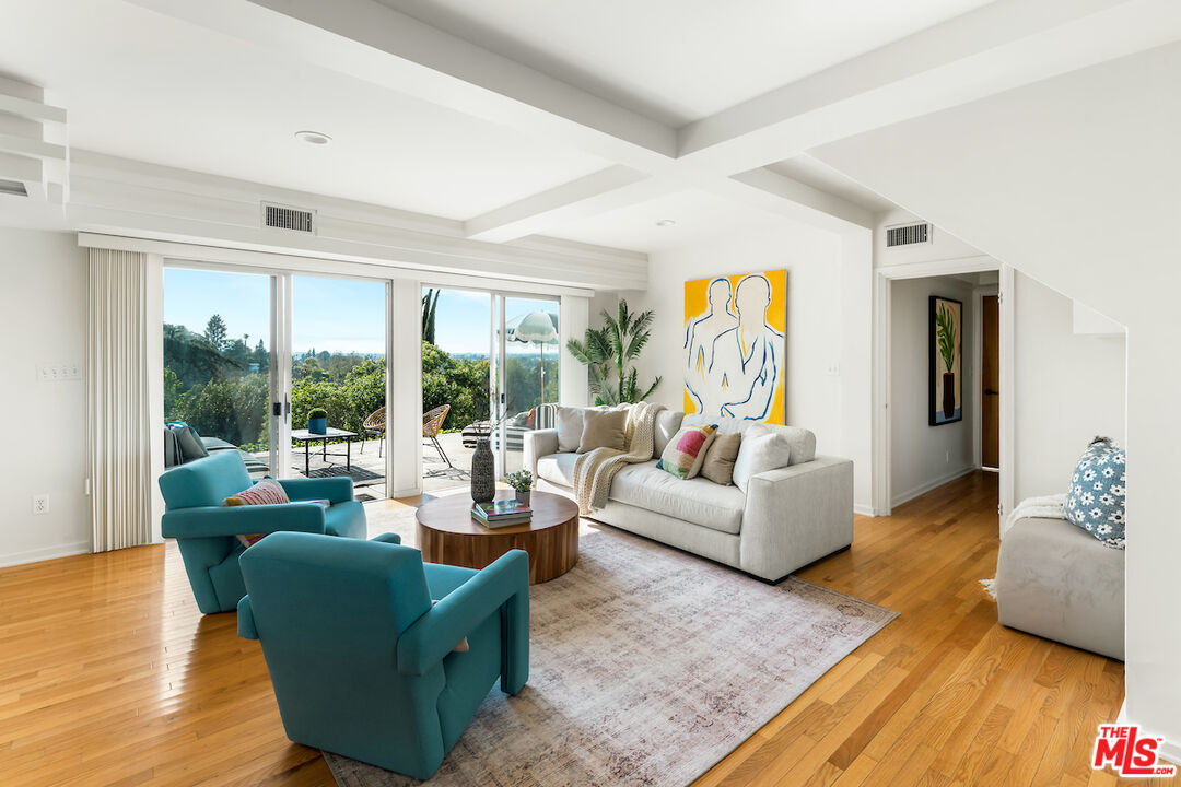 13201 Cheltenham Drive Sherman Oaks, CA 91423 - Photo 23 of 75 a living room with furniture and a large window