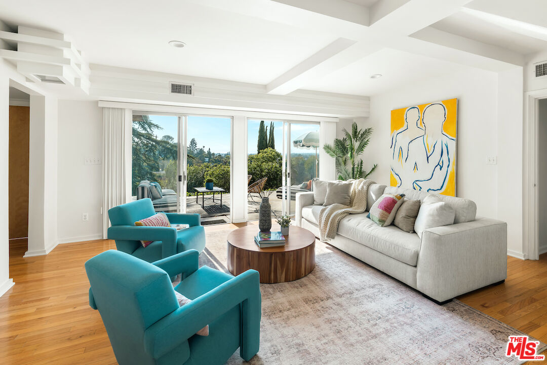 13201 Cheltenham Drive Sherman Oaks, CA 91423 - Photo 24 of 75 a living room with furniture and a large window