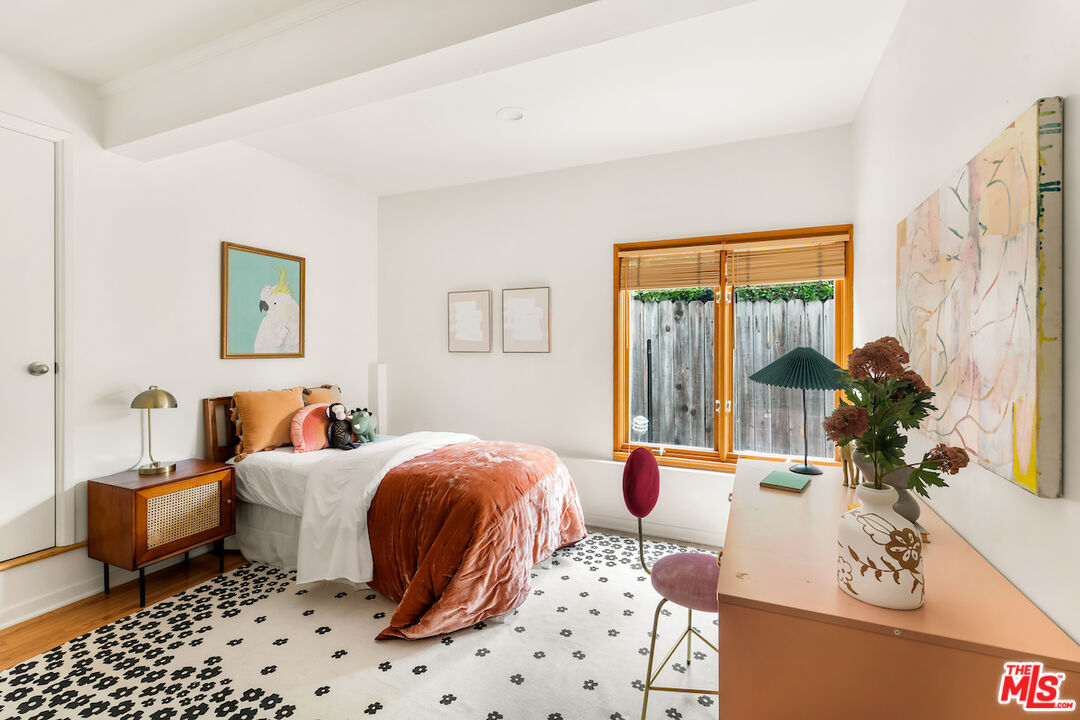 13201 Cheltenham Drive Sherman Oaks, CA 91423 - Photo 25 of 75 a bedroom with furniture and a window