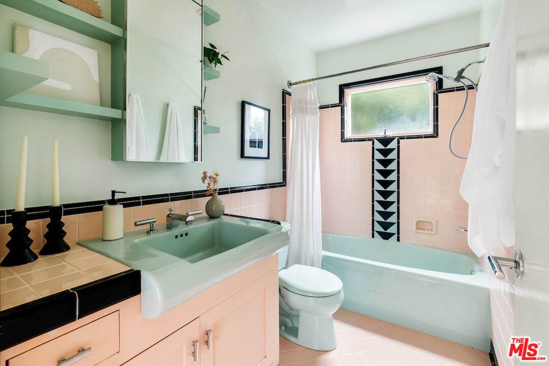 13201 Cheltenham Drive Sherman Oaks, CA 91423 - Photo 29 of 75 a bathroom with a sink a toilet and bathtub