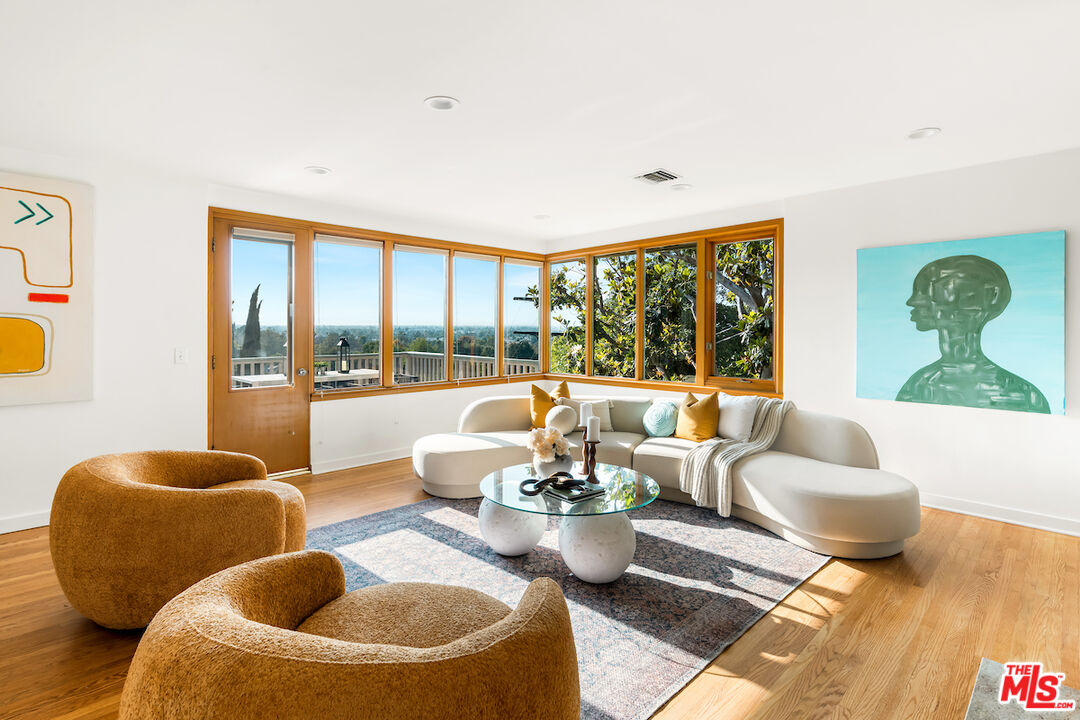 13201 Cheltenham Drive Sherman Oaks, CA 91423 - Photo 3 of 75 a living room with furniture and a large window