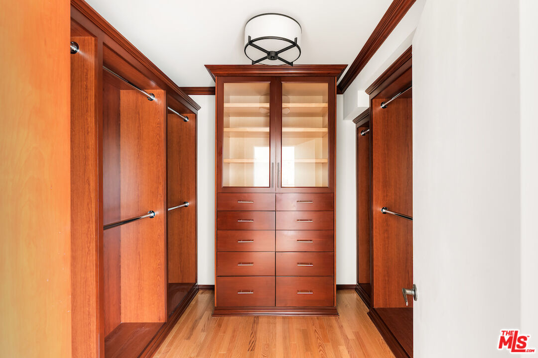13201 Cheltenham Drive Sherman Oaks, CA 91423 - Photo 38 of 75 a view of a room with wooden floor and windows