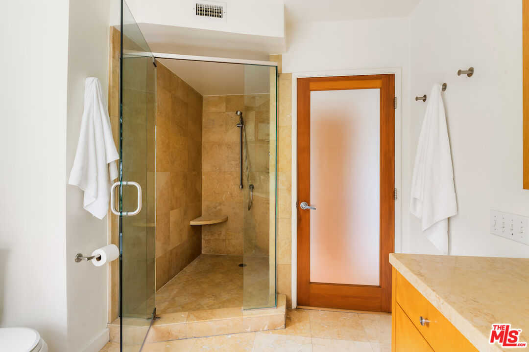 13201 Cheltenham Drive Sherman Oaks, CA 91423 - Photo 44 of 75 a bathroom with a shower and a sink