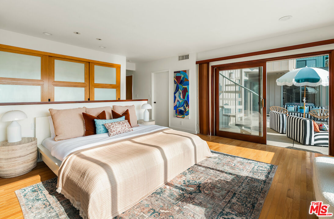 13201 Cheltenham Drive Sherman Oaks, CA 91423 - Photo 46 of 75 a bedroom with a large bed and a large window