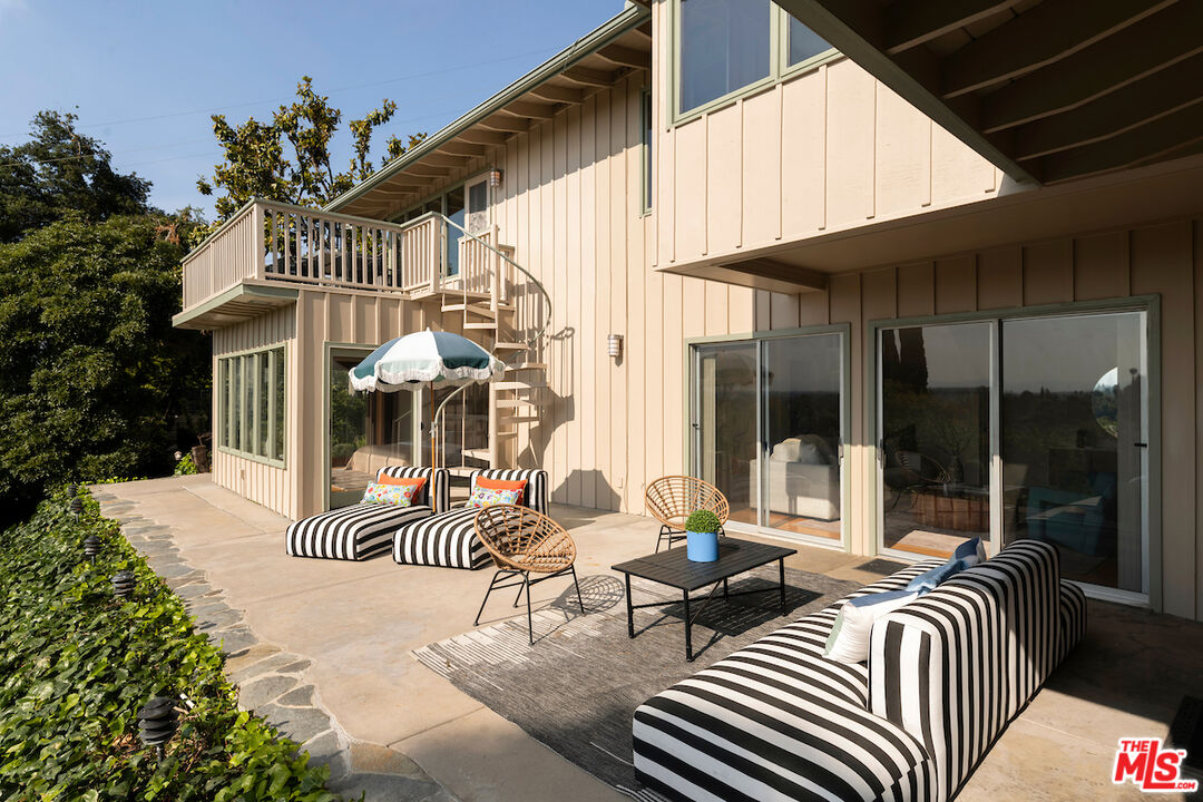 13201 Cheltenham Drive Sherman Oaks, CA 91423 - Photo 47 of 75 a view of a patio with couches table and chairs and potted plants