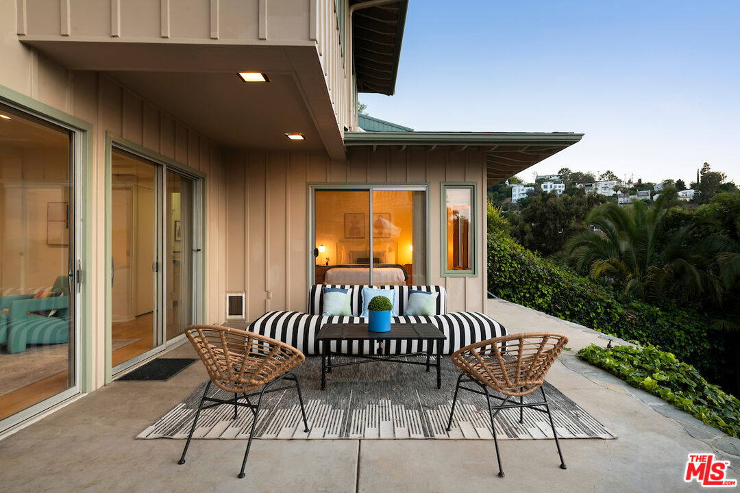 13201 Cheltenham Drive Sherman Oaks, CA 91423 - Photo 49 of 75 a view of a chairs and table in patio of a house