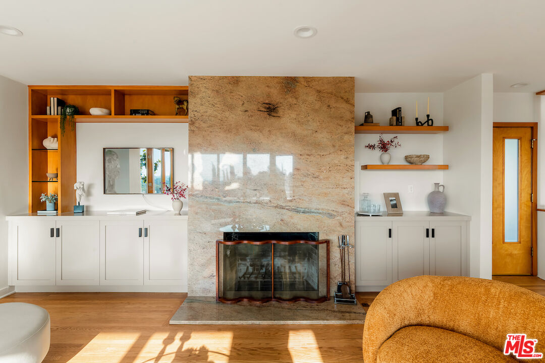 13201 Cheltenham Drive Sherman Oaks, CA 91423 - Photo 5 of 75 a bedroom with a bed and a fireplace