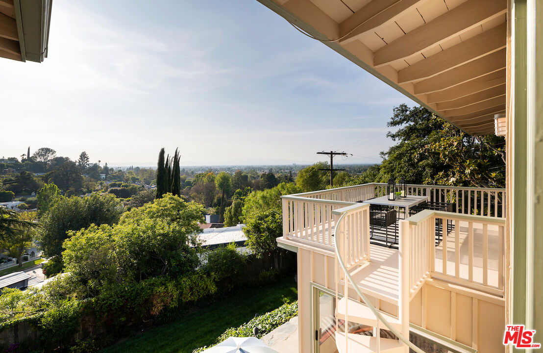 13201 Cheltenham Drive Sherman Oaks, CA 91423 - Photo 54 of 75 a view of a balcony with chairs