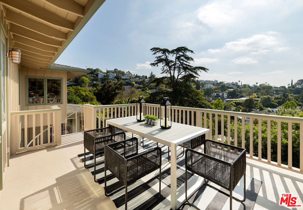 13201 Cheltenham Drive Sherman Oaks, CA 91423 - Photo 55 of 75 a view of a dinning table and chairs on the roof deck
