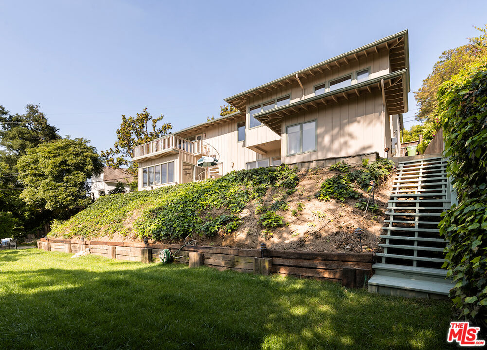 13201 Cheltenham Drive Sherman Oaks, CA 91423 - Photo 59 of 75 a front view of house with a garden
