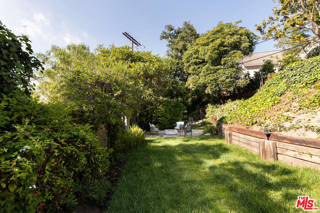 13201 Cheltenham Drive Sherman Oaks, CA 91423 - Photo 60 of 75 a backyard of a house with a yard and outdoor seating