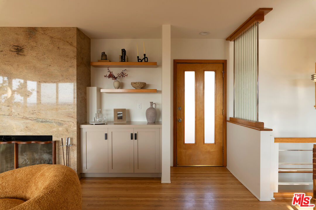 13201 Cheltenham Drive Sherman Oaks, CA 91423 - Photo 6 of 75 a view of a hallway with wooden floor and entryway
