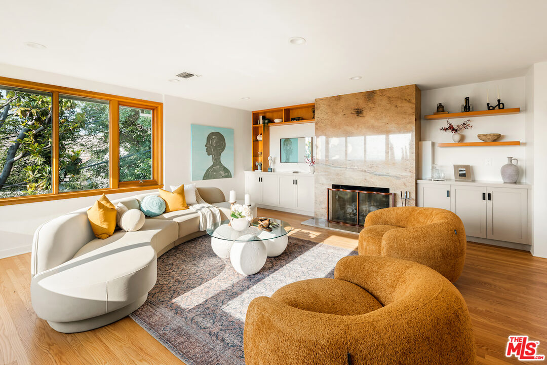 13201 Cheltenham Drive Sherman Oaks, CA 91423 - Photo 7 of 75 a living room with furniture fireplace and a large window
