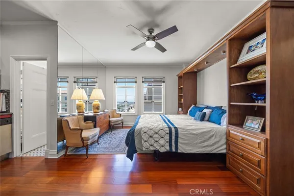 a bedroom with bed and a flat tv screen