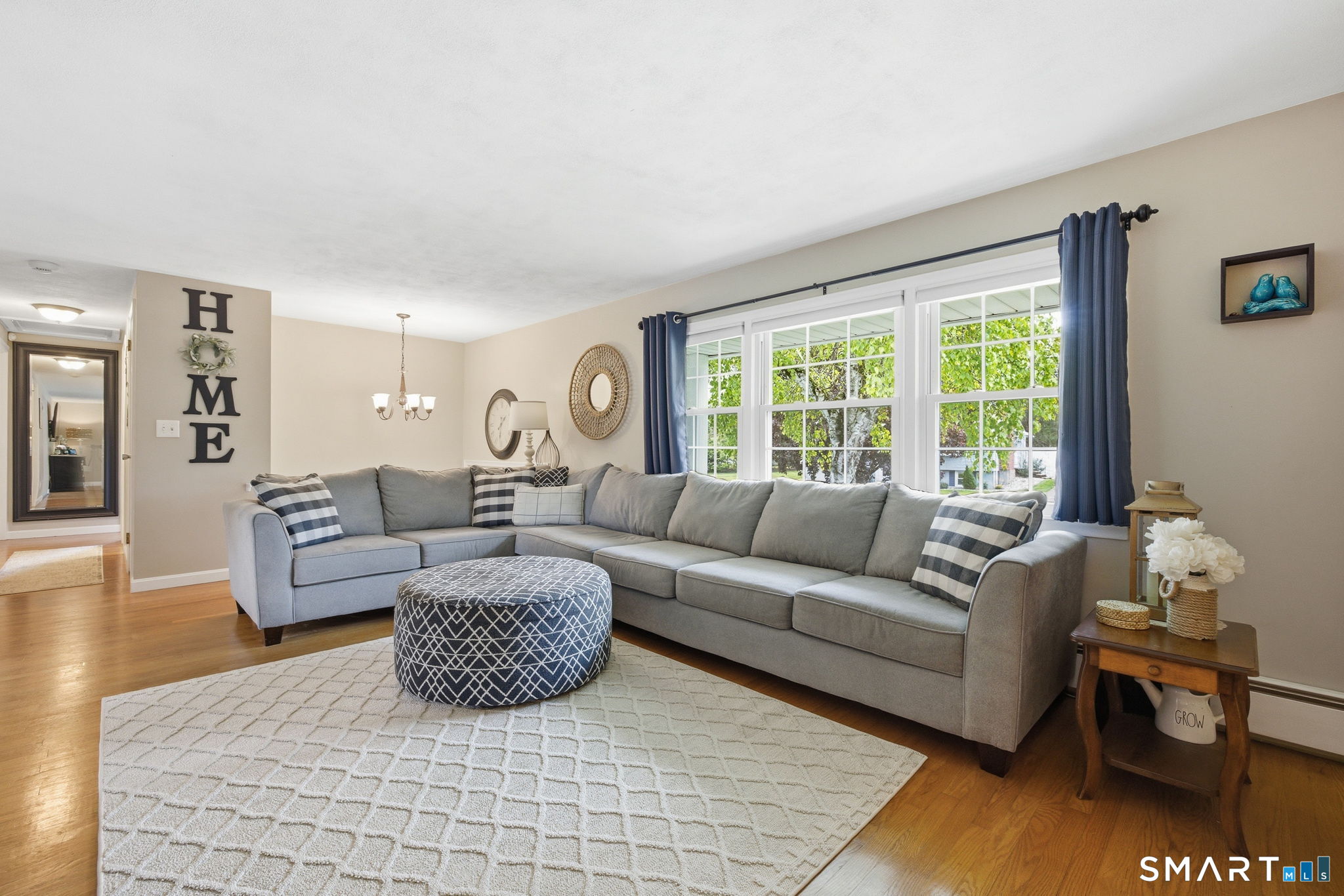 7 Stardust Drive Enfield, CT 06082 - Photo 4 of 38 a living room with furniture and a large window