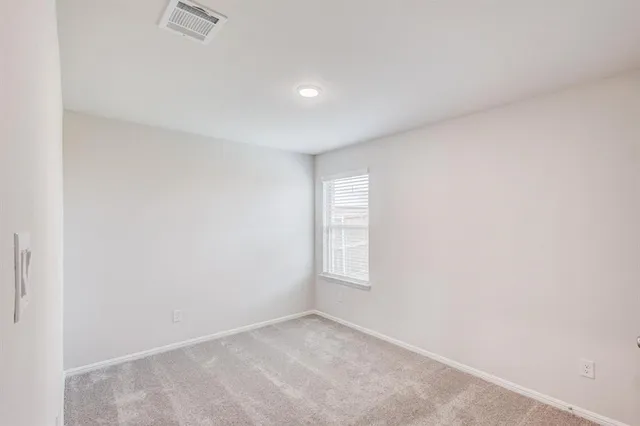 an empty room with window